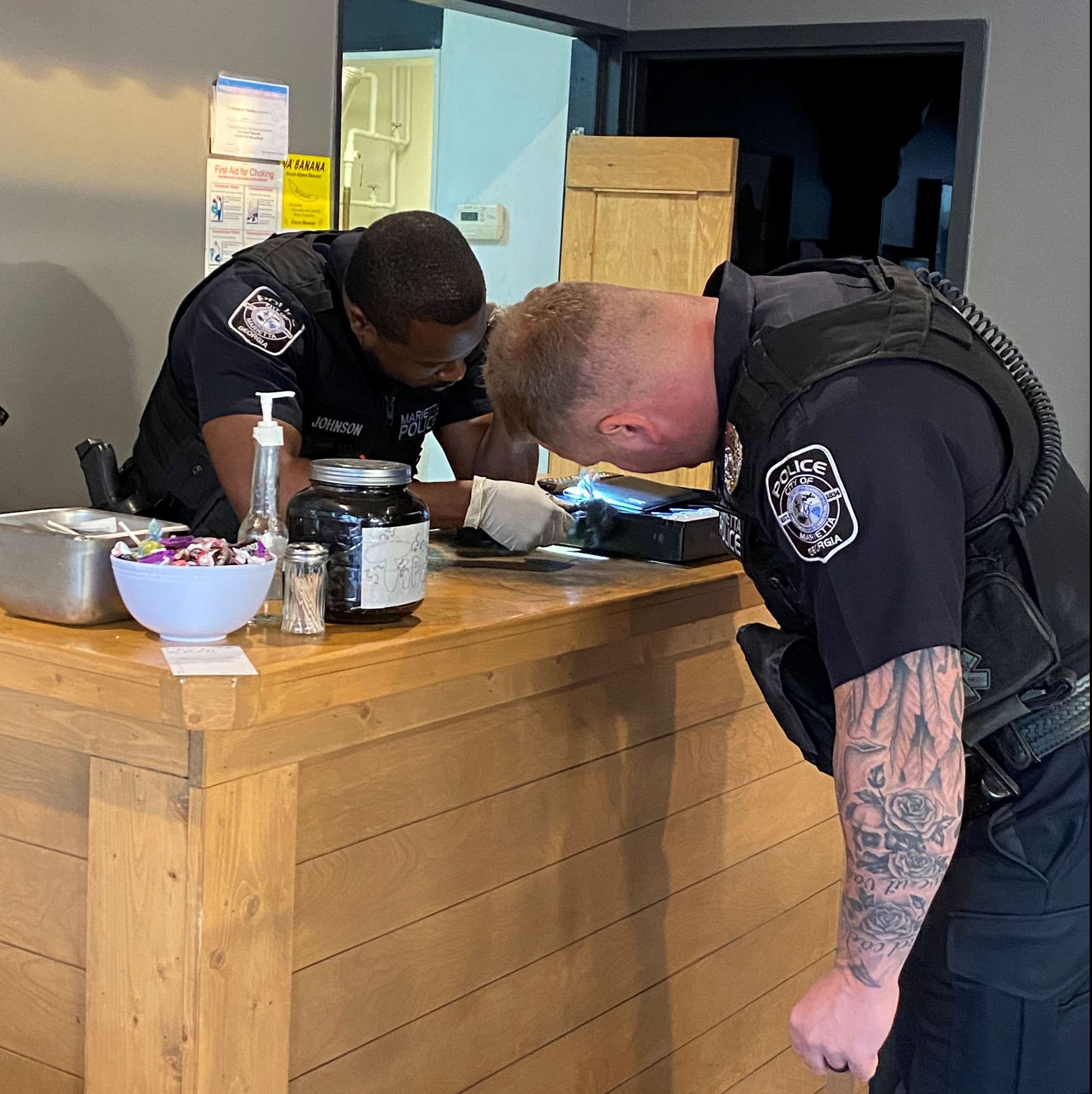 2 Officers gathering evidence